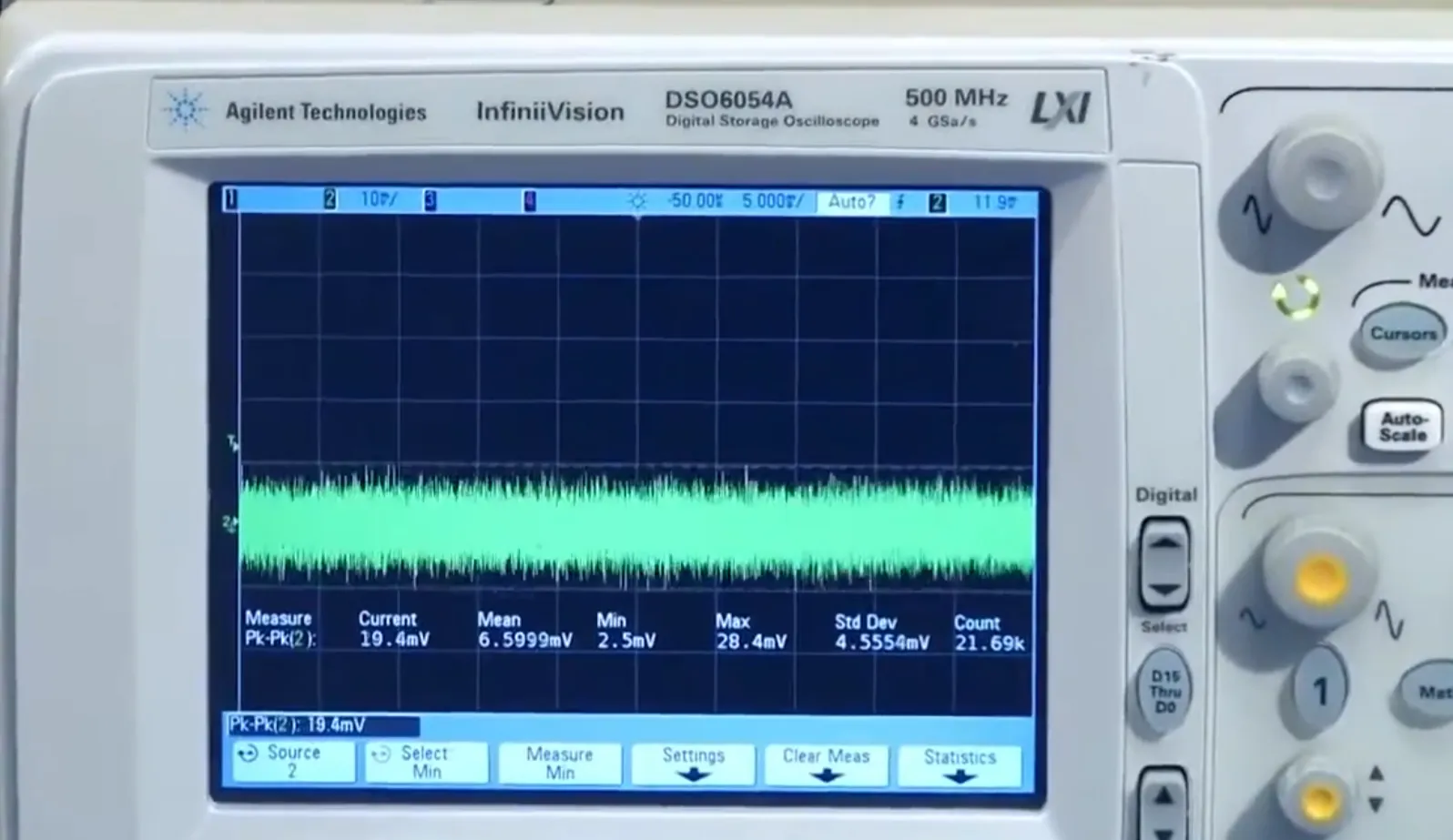 Oscilloscope screen showing noisy DC power line